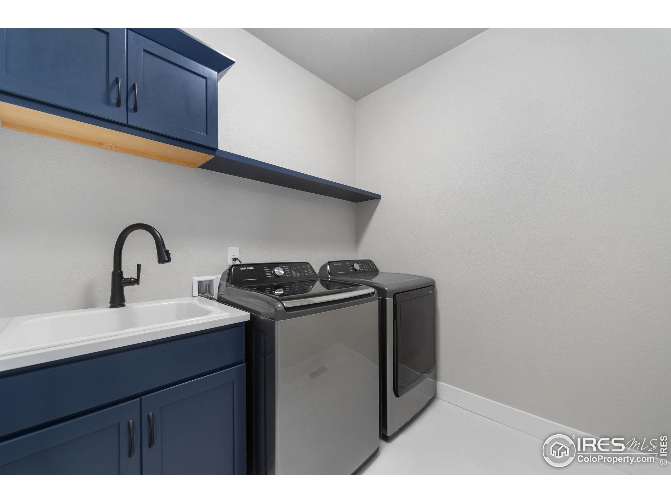 2748 Prairie Flax Street Berthoud, CO 80513 - Photo 23 of 40 a utility room with dryer and washer