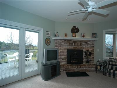 4820 Pressley Road Santa Rosa, CA 95404 - Photo 5 of 9 a living room with furniture a flat screen tv and a fireplace