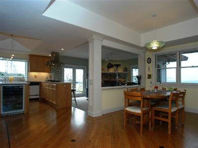 4820 Pressley Road Santa Rosa, CA 95404 - Photo 7 of 9 a dining room with furniture wooden floor and a kitchen