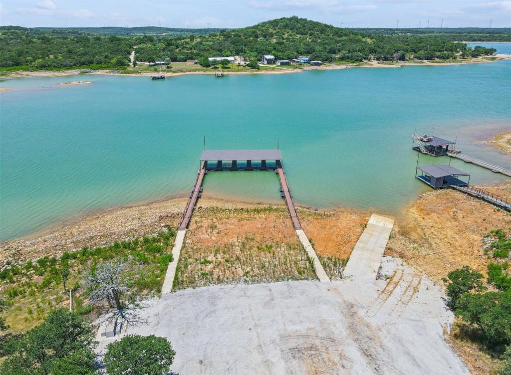 141 Scenic Ridge Drive Cisco, TX 76437 - Photo 7 of 9 an aerial view of a house with a lake view