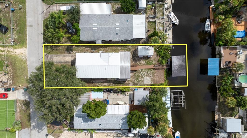 126 Charles Street Edgewater, FL 32141 - Photo 3 of 40 an aerial view of house with a swimming pool