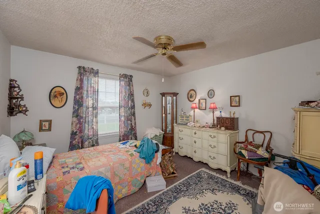 a bed room with a bed and a desk