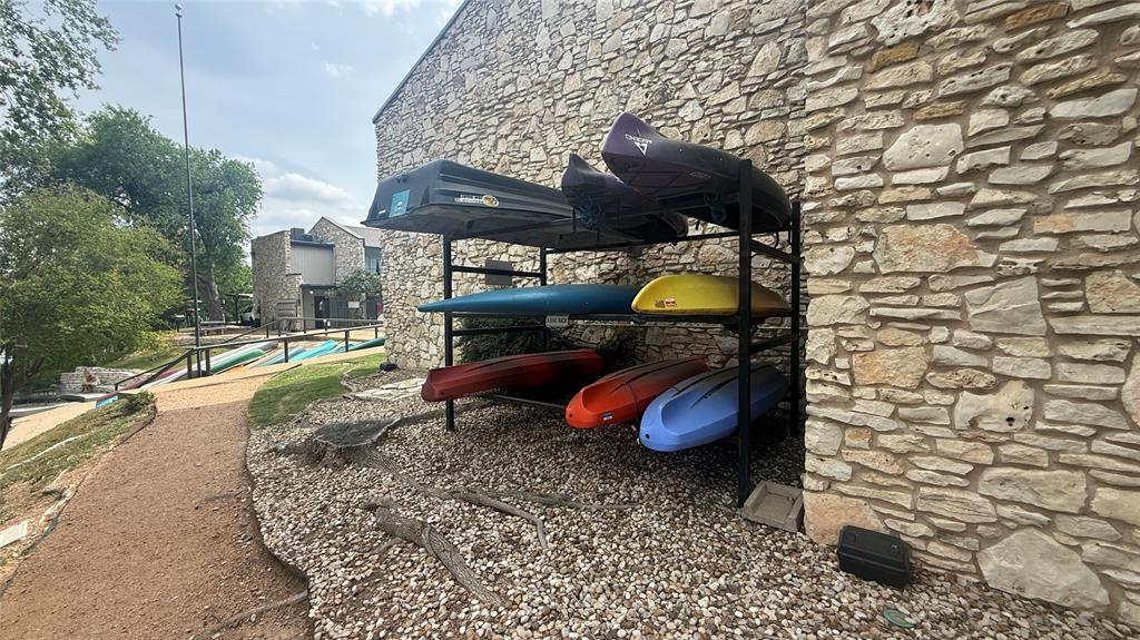500 East Riverside Drive, Unit 132 Austin, TX 78704 - Photo 22 of 31 a view of a backyard with table and chairs