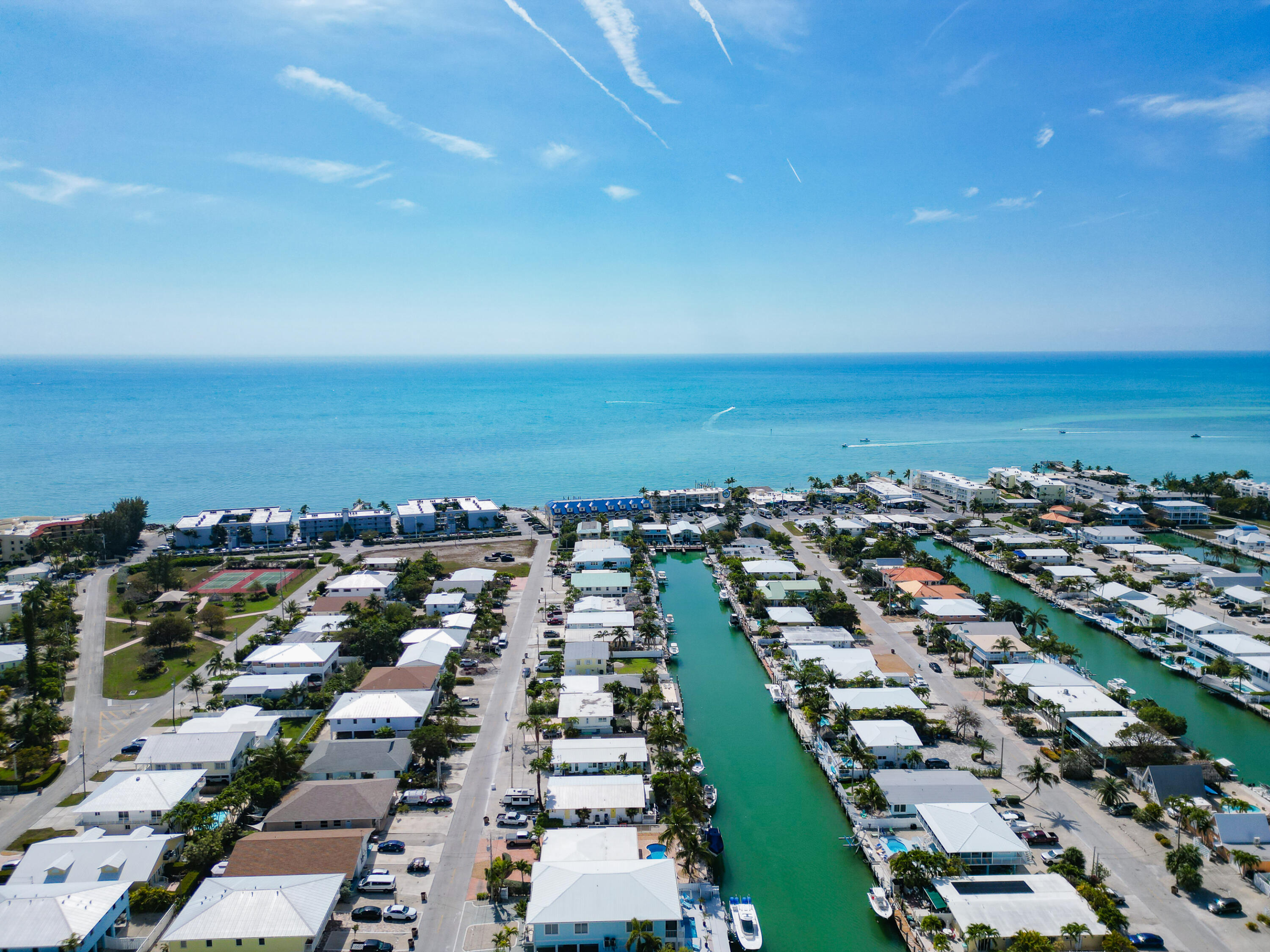 341 3rd Street Key Colony Beach, FL 33051 - Photo 11 of 42 an aerial view of a city with lots of residential buildings and ocean view in back