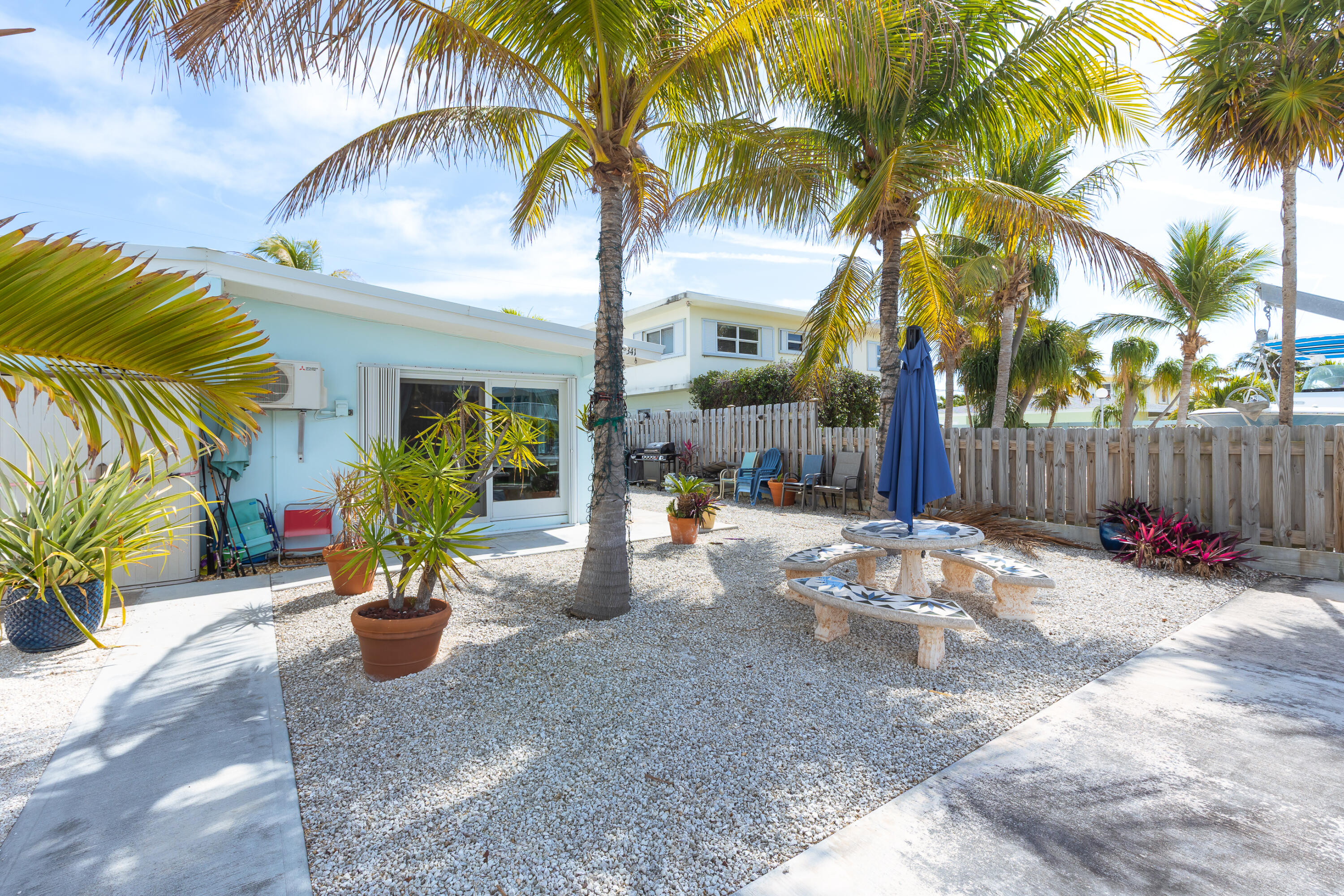 341 3rd Street Key Colony Beach, FL 33051 - Photo 17 of 42 a view of a backyard with a trees