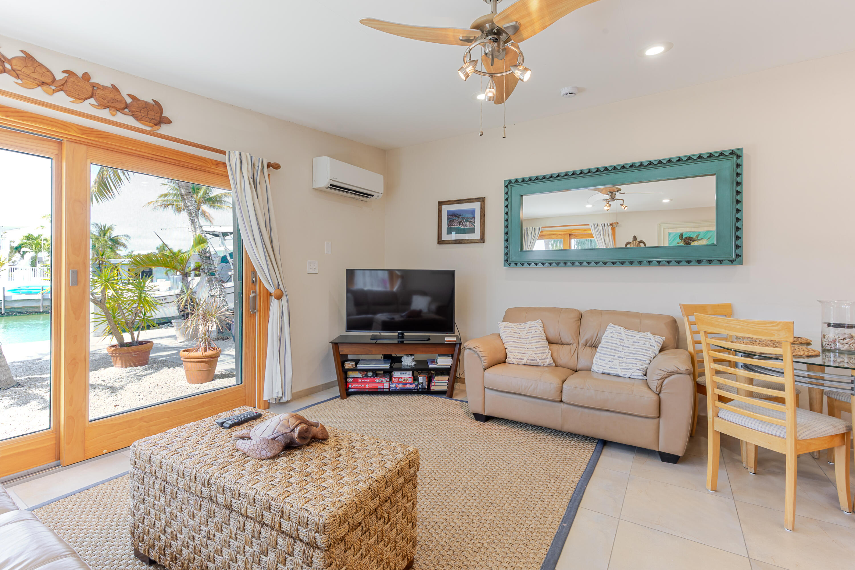 341 3rd Street Key Colony Beach, FL 33051 - Photo 20 of 42 a living room with furniture and a flat screen tv