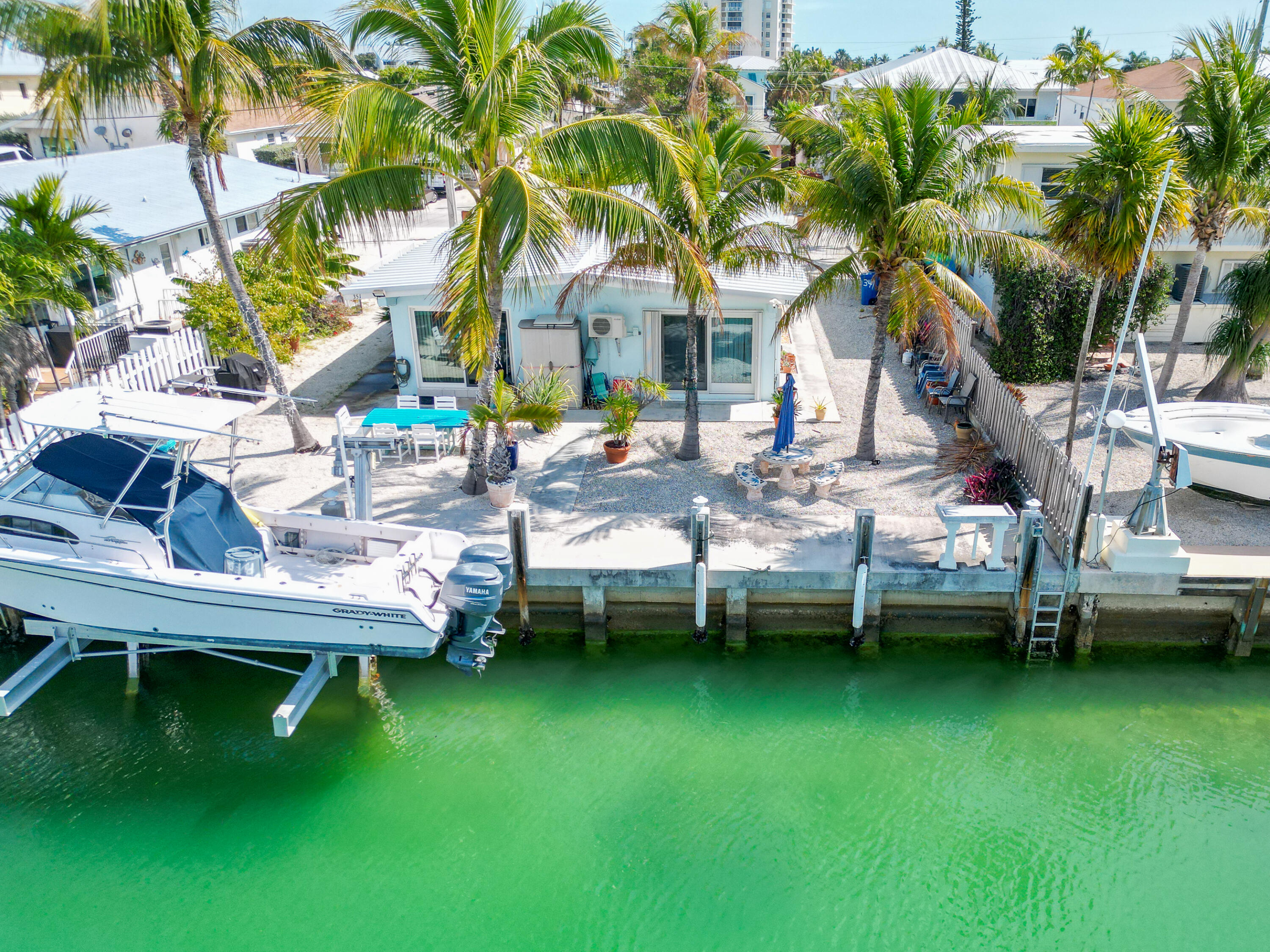 341 3rd Street Key Colony Beach, FL 33051 - Photo 2 of 42 a view of a house with backyard porch and sitting area