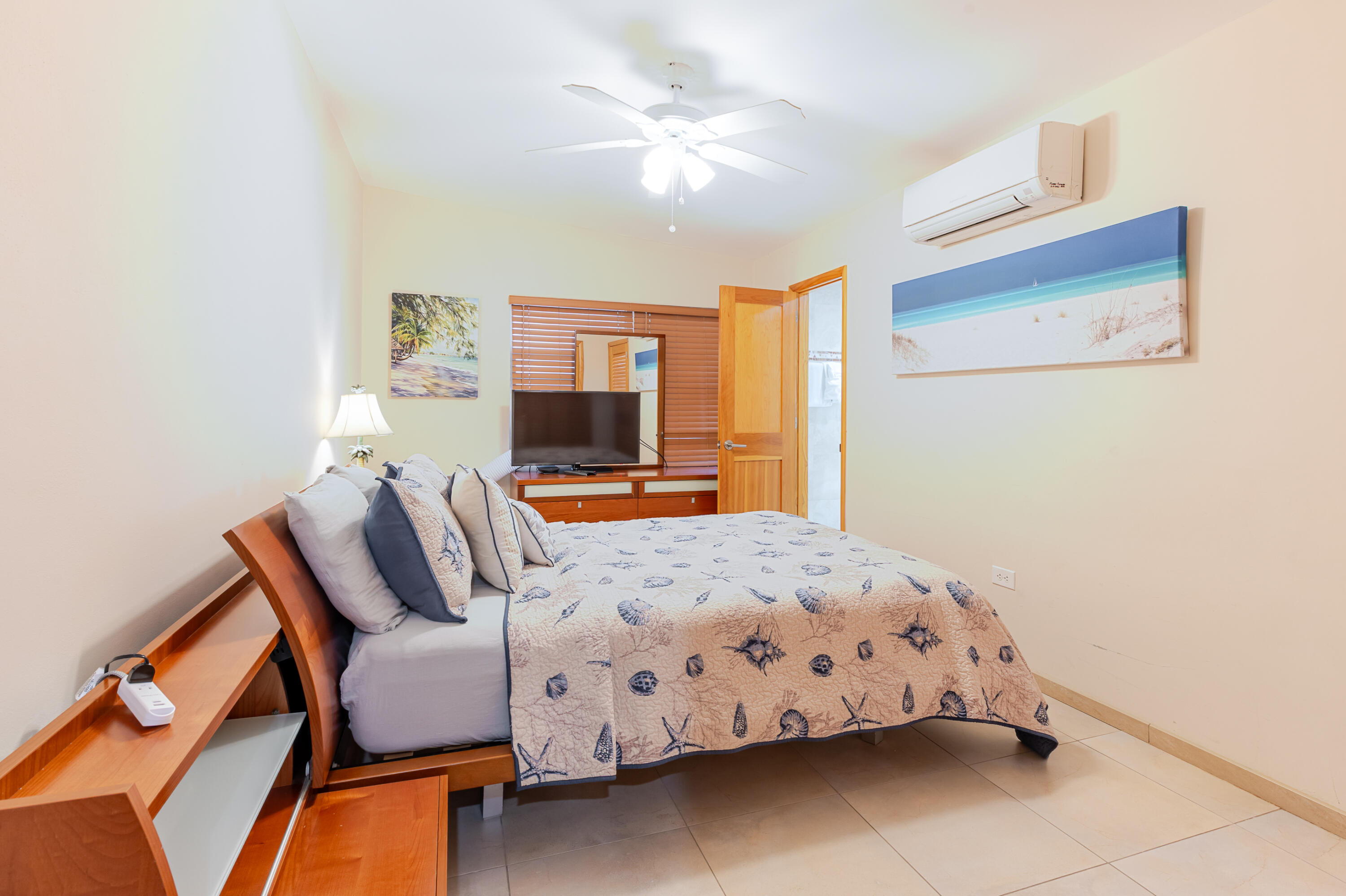 341 3rd Street Key Colony Beach, FL 33051 - Photo 41 of 42 a bedroom with furniture and a chandelier