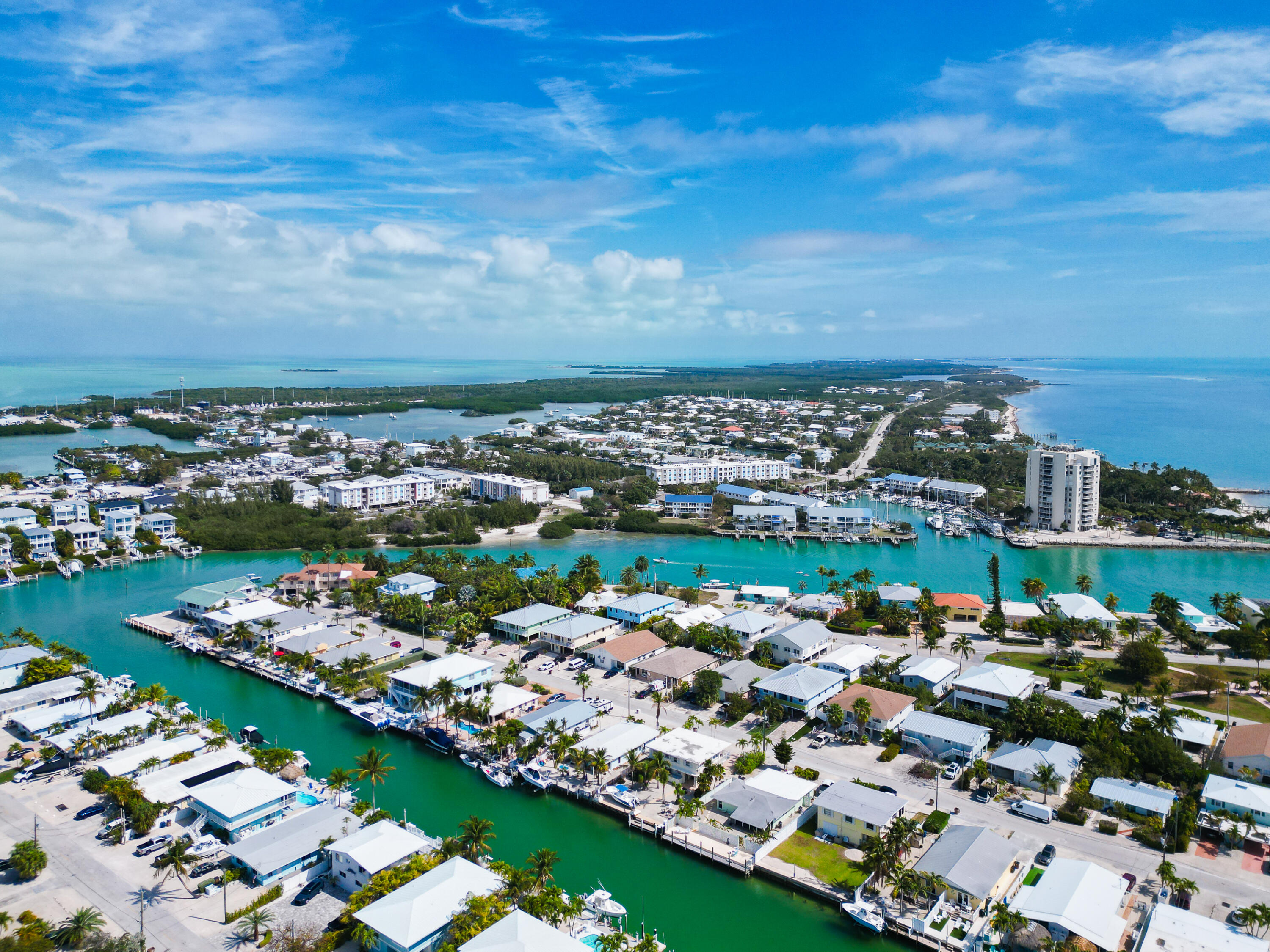 341 3rd Street Key Colony Beach, FL 33051 - Photo 5 of 42 an aerial view of a city with lots of residential buildings ocean and mountain view in back
