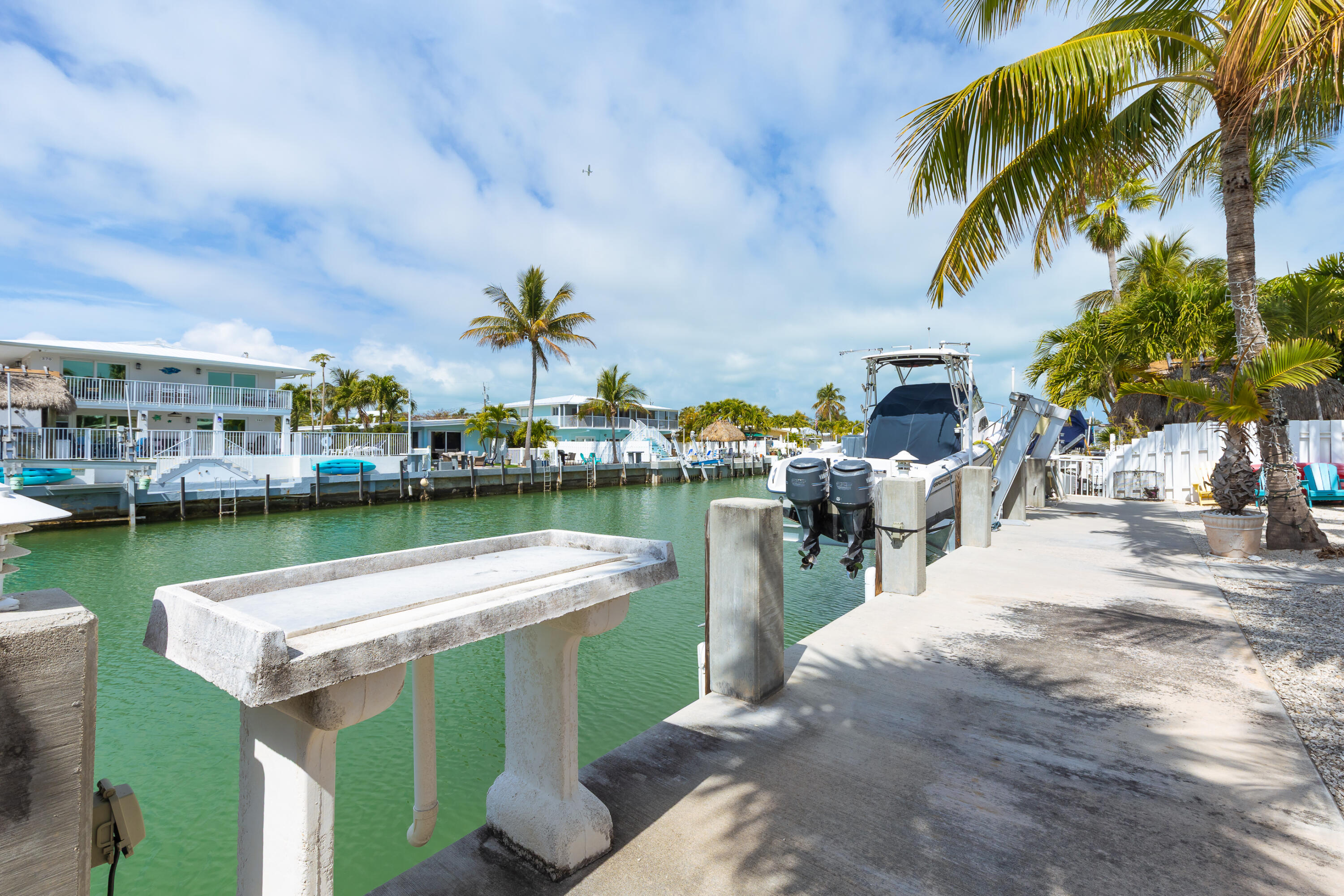 341 3rd Street Key Colony Beach, FL 33051 - Photo 9 of 42 a view of a lake with a table and chairs