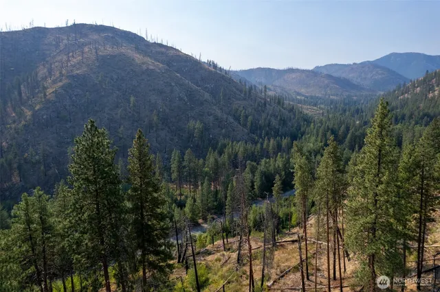 a view of a house with a mountain in the background