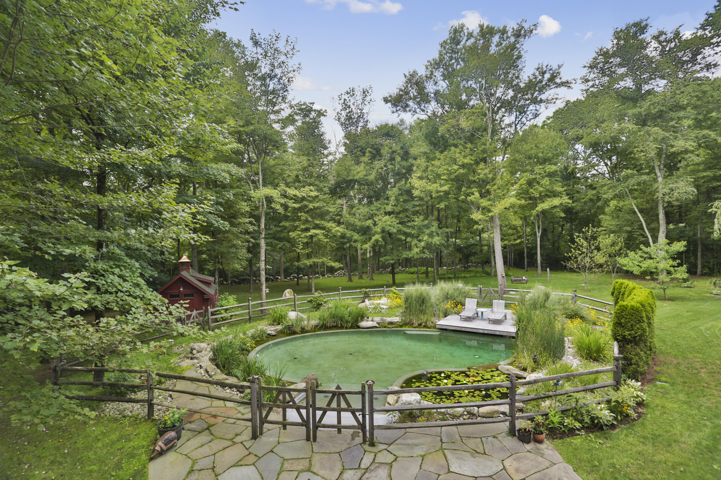 494 June Road Stamford, CT 06831 - Photo 38 of 47 a view of a table and chairs in a garden