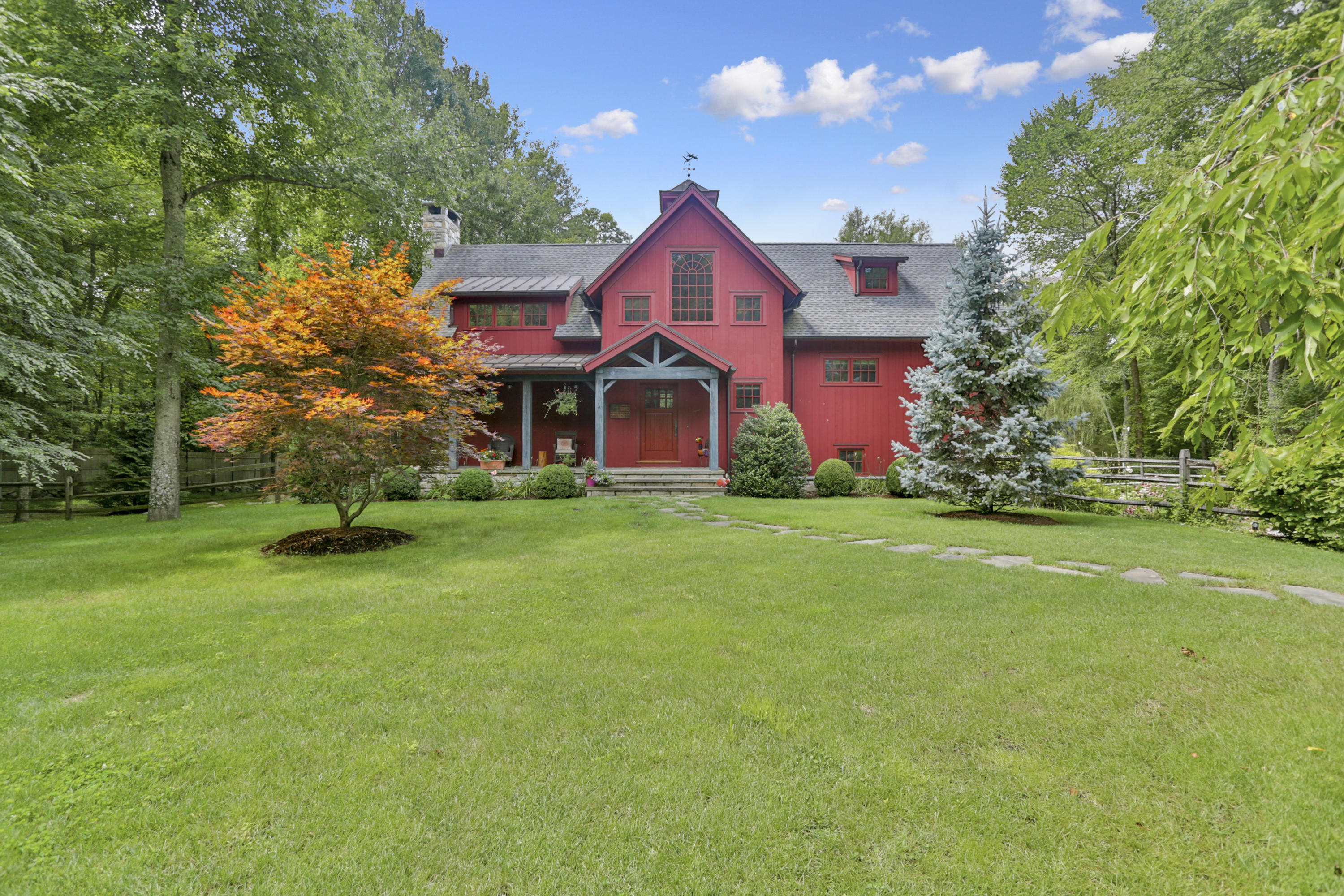 494 June Road Stamford, CT 06831 - Photo 4 of 47 a front view of house with yard and green space