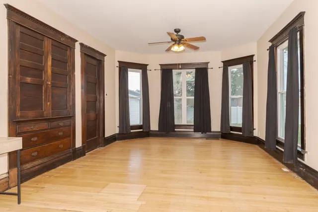 a view of a livingroom with furniture and staircase
