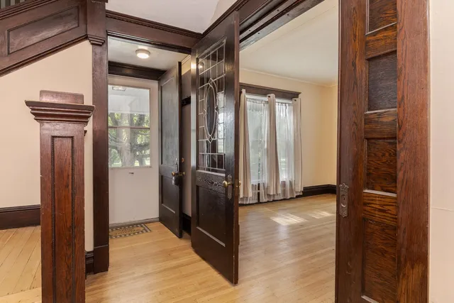 a view of empty room with floor to ceiling window