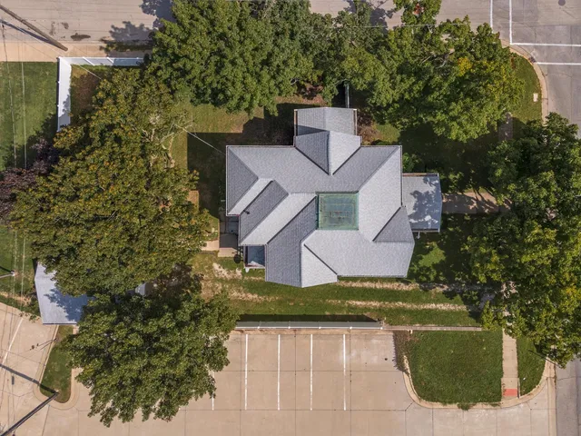 an aerial view of a house with a garden