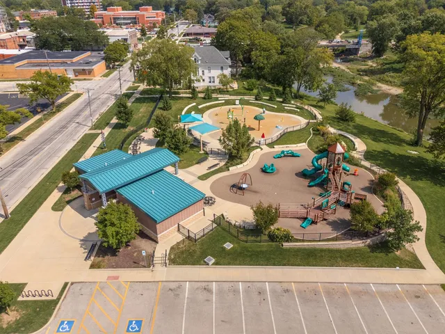 an aerial view of a house with swimming pool and ocean view