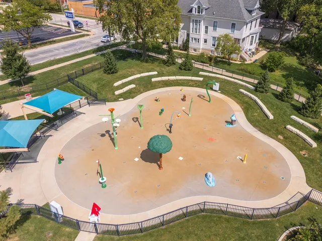 a view of a lake with houses in the back