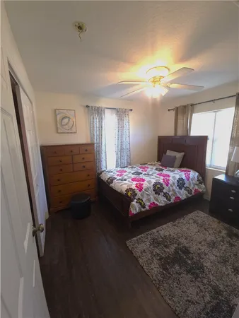 a bedroom with bed and window