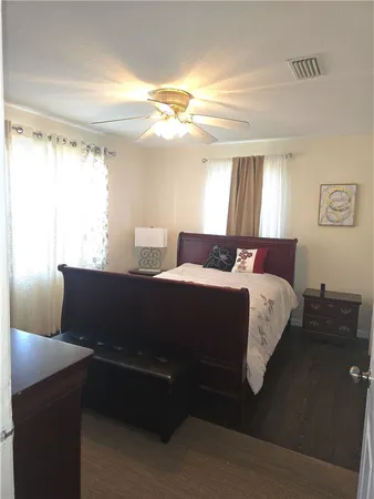 a bedroom with a bed and window