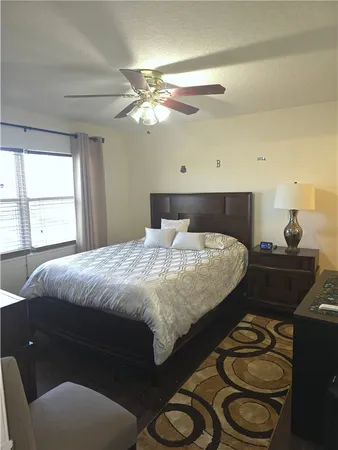 a bedroom with a bed and window