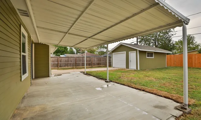 a view of a backyard of the house