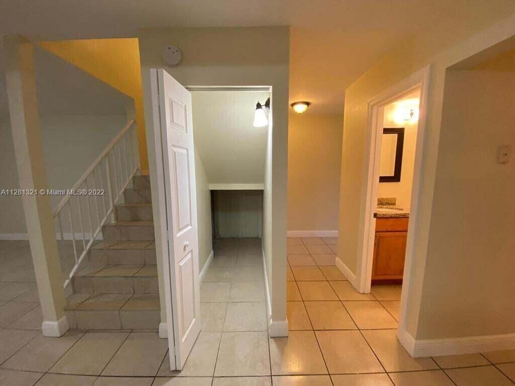 2800 Georgia Avenue, Unit 82 West Palm Beach, FL 33405 - Photo 6 of 12 a view of a hallway to rooms and stairs