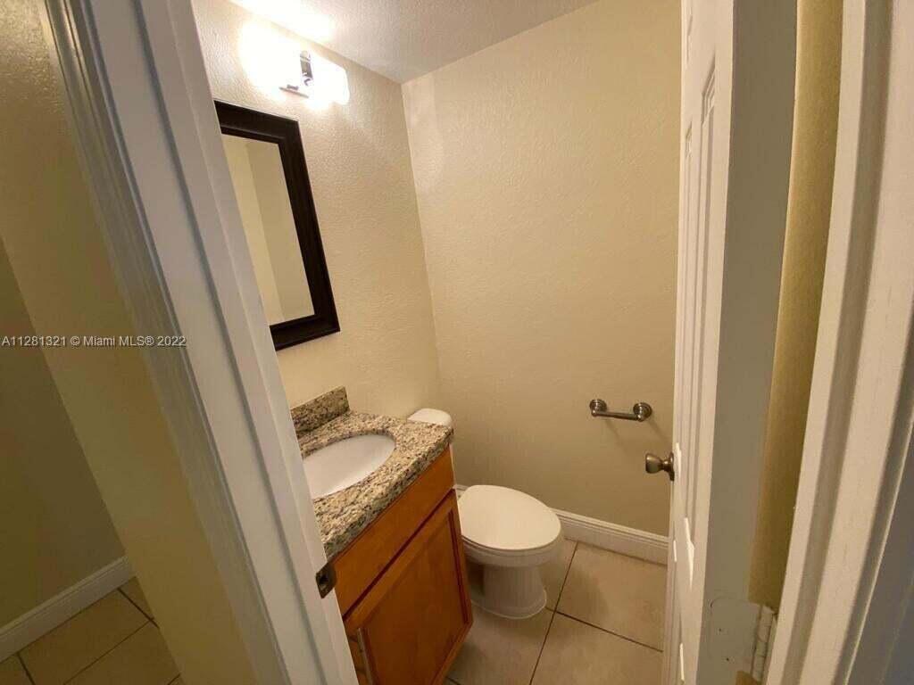 2800 Georgia Avenue, Unit 82 West Palm Beach, FL 33405 - Photo 10 of 12 a bathroom with a sink and a mirror