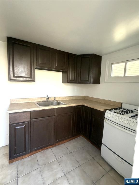 185 Hudson Street Hackensack, NJ 07601 - Photo 4 of 7 a kitchen with a cabinets and white appliances
