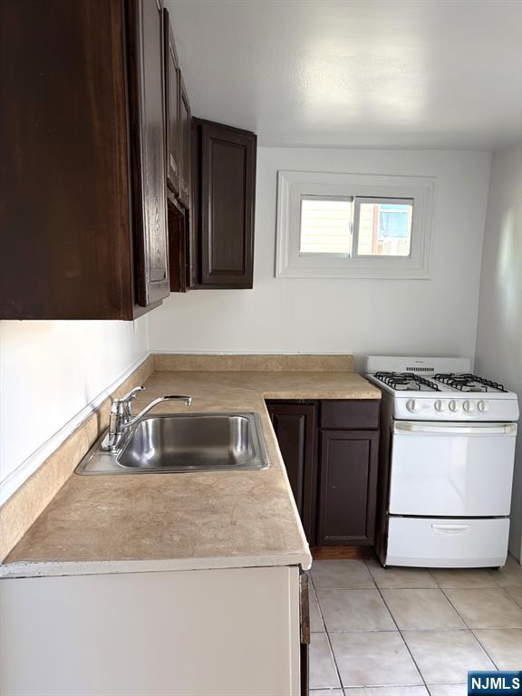 185 Hudson Street Hackensack, NJ 07601 - Photo 5 of 7 a kitchen with a stove and a sink