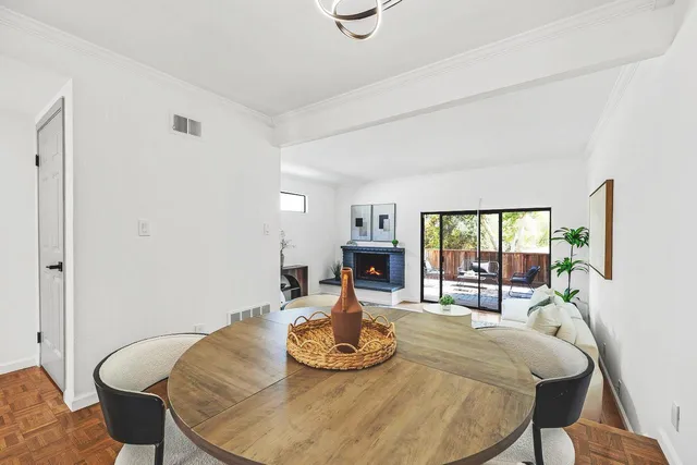 a dining room with table and chairs