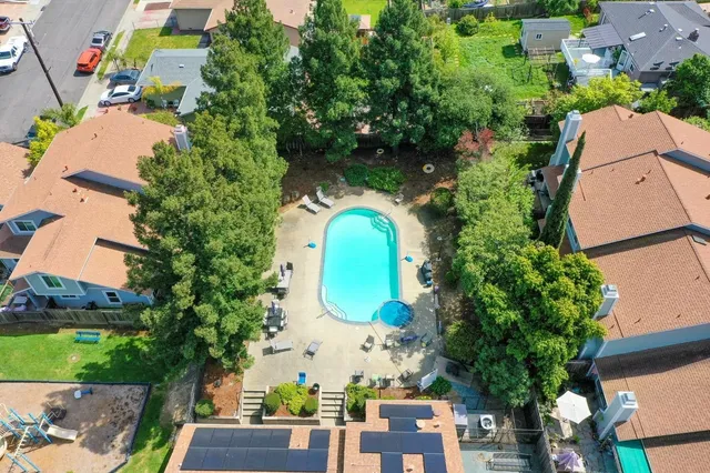 a view of staircase with wooden floor and white walls