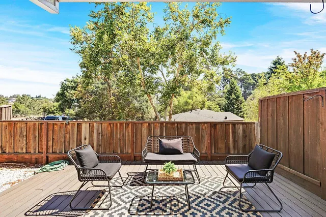 a patio with patio a fire pit and furniture