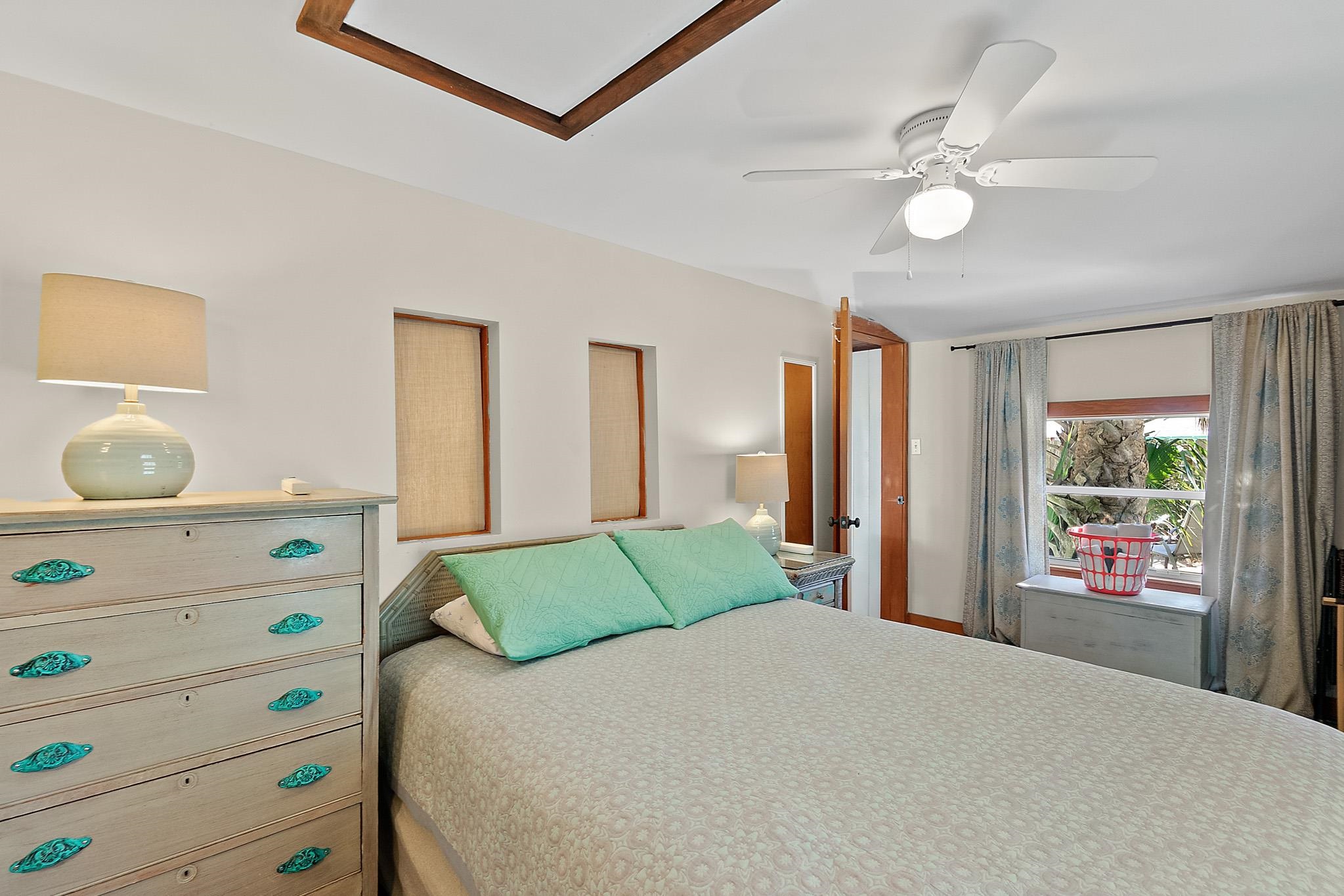 51 Beachcomber Way St. Augustine, FL 32084 - Photo 13 of 46 a bedroom with a bed and a window