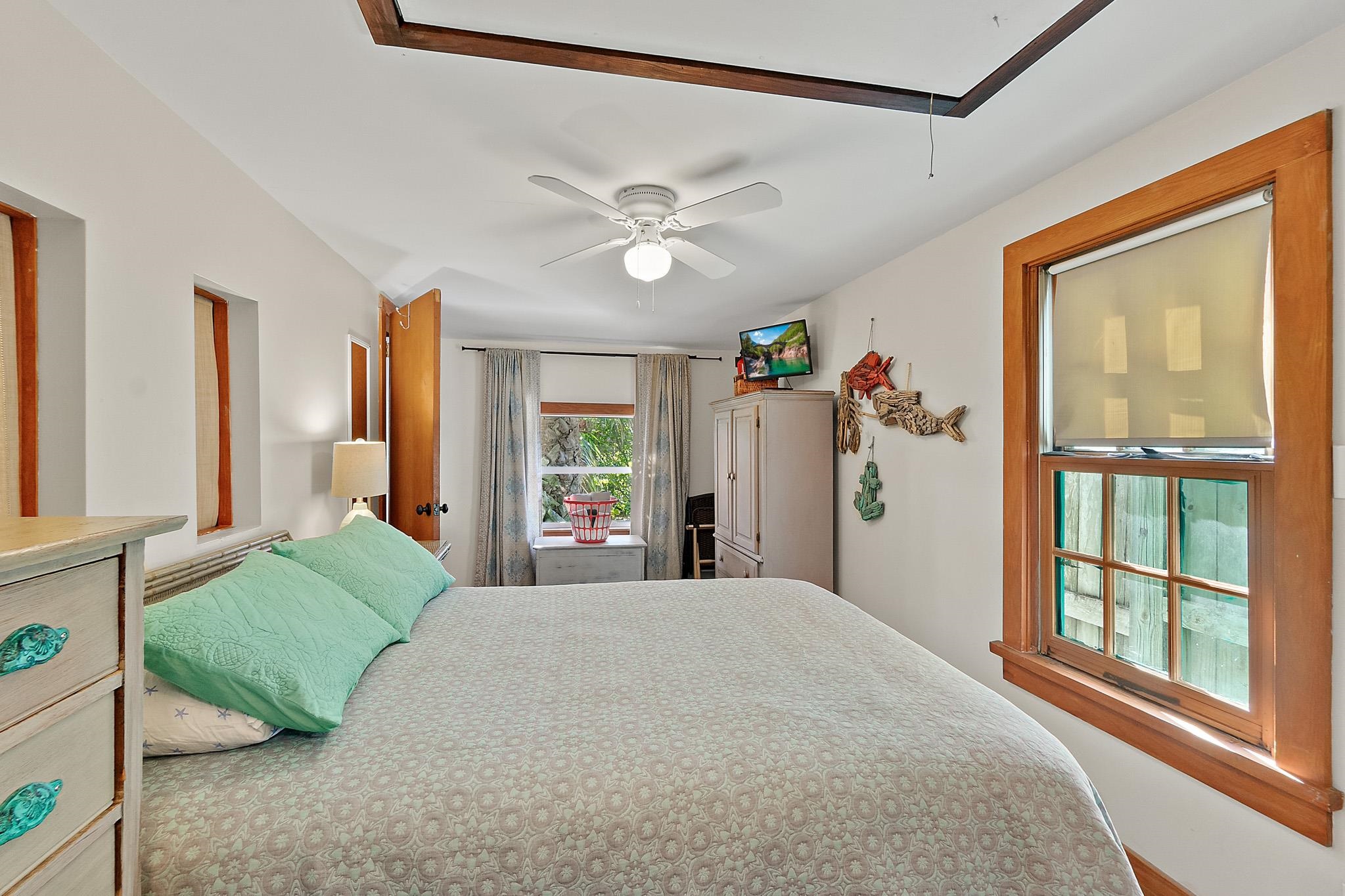 51 Beachcomber Way St. Augustine, FL 32084 - Photo 14 of 46 a bedroom with a large bed and a large window