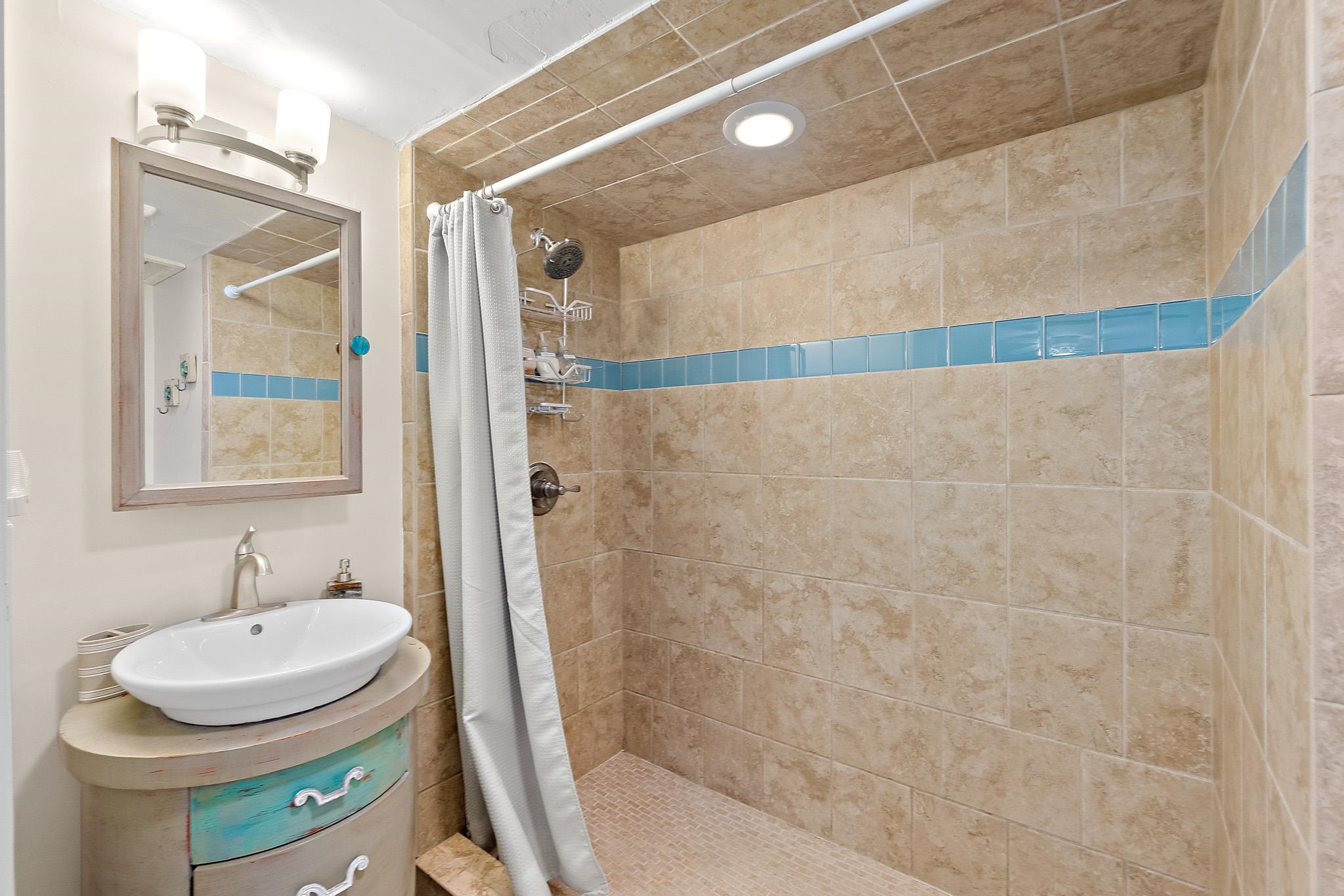 51 Beachcomber Way St. Augustine, FL 32084 - Photo 16 of 46 a bathroom with a sink and a mirror