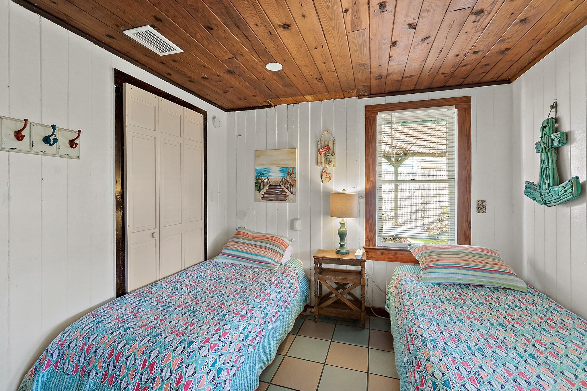 51 Beachcomber Way St. Augustine, FL 32084 - Photo 18 of 46 a bedroom with a bed and wooden floor