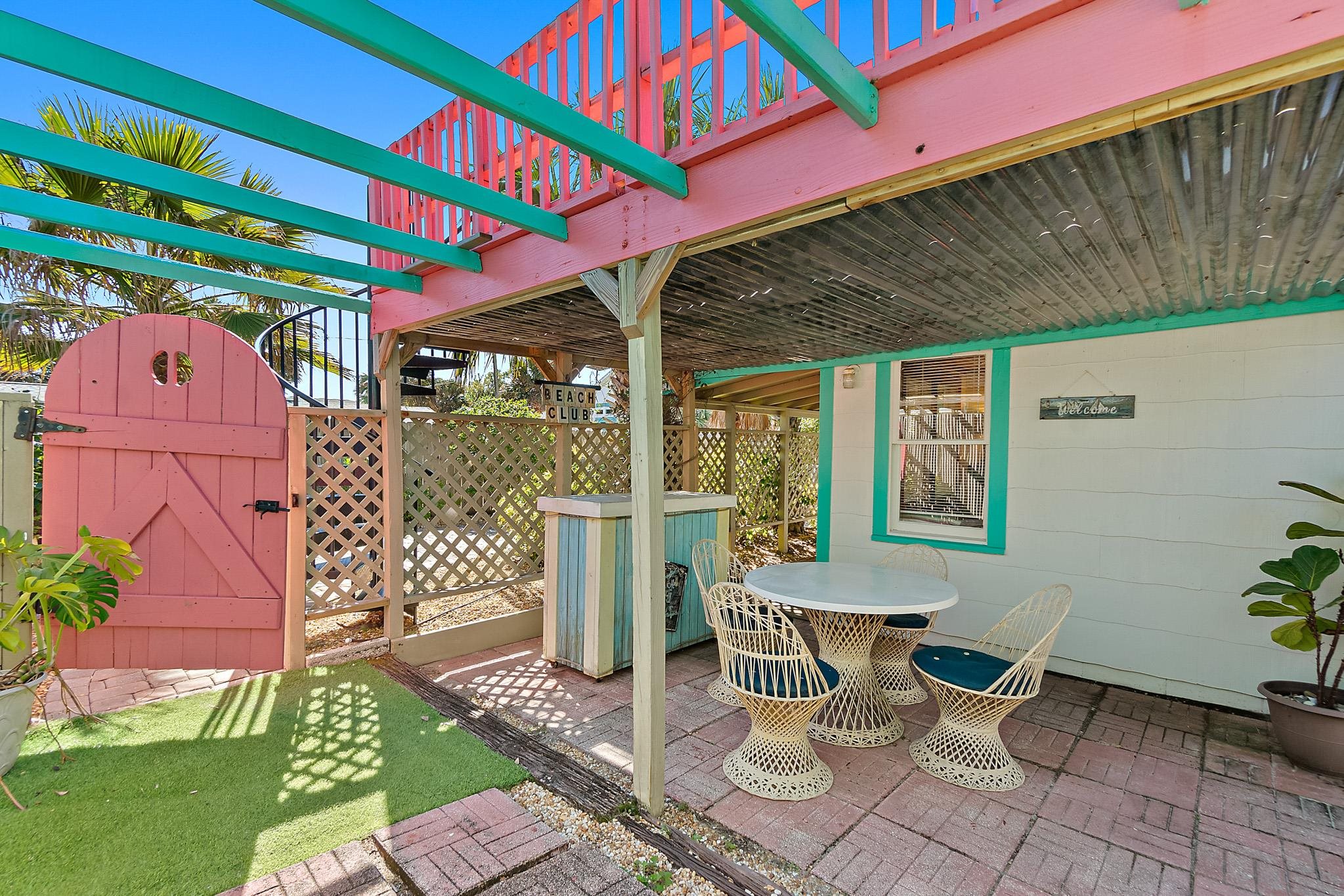 51 Beachcomber Way St. Augustine, FL 32084 - Photo 28 of 46 a view of a patio with a table and chairs
