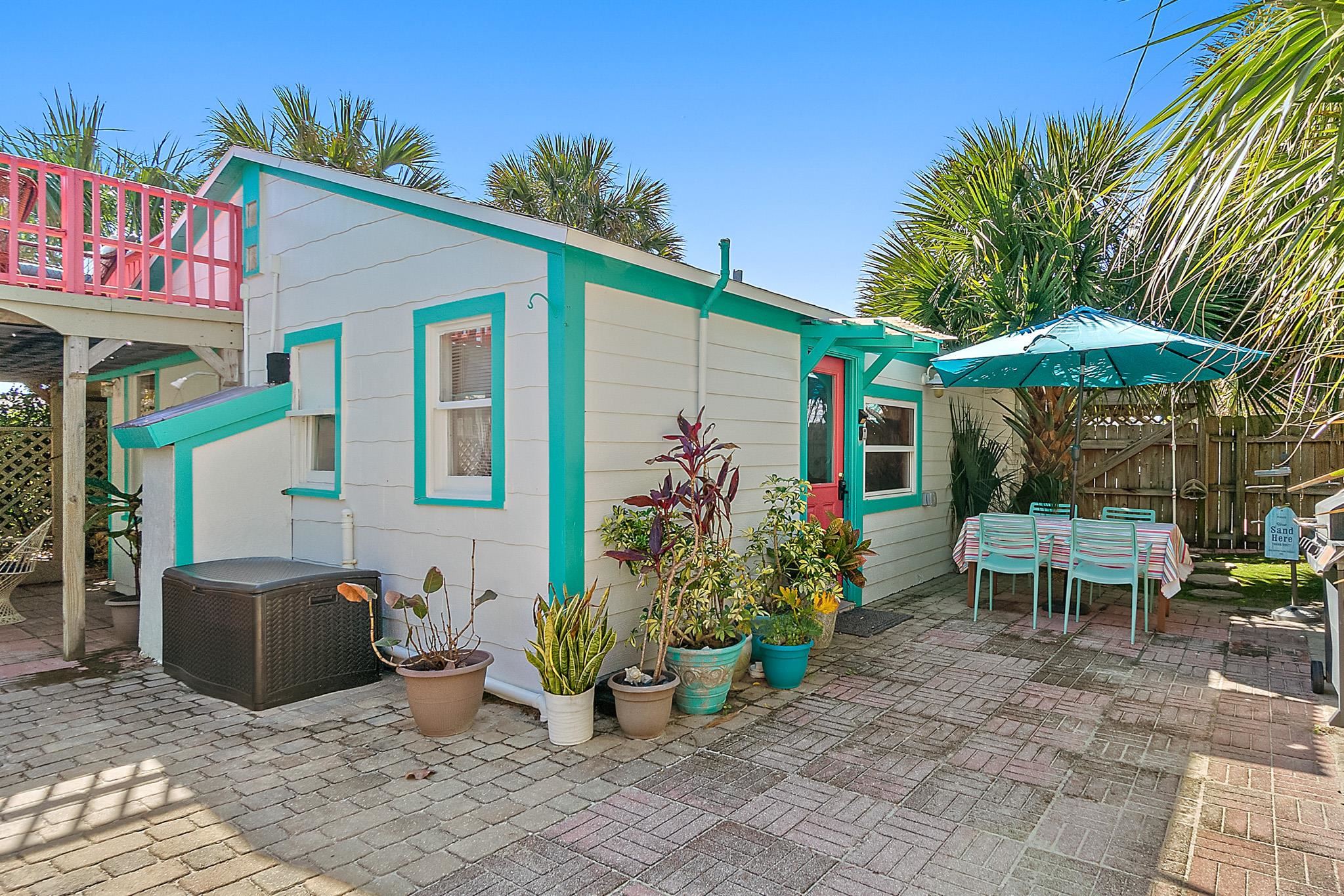 51 Beachcomber Way St. Augustine, FL 32084 - Photo 3 of 46 a view of a patio with table and chairs under an umbrella