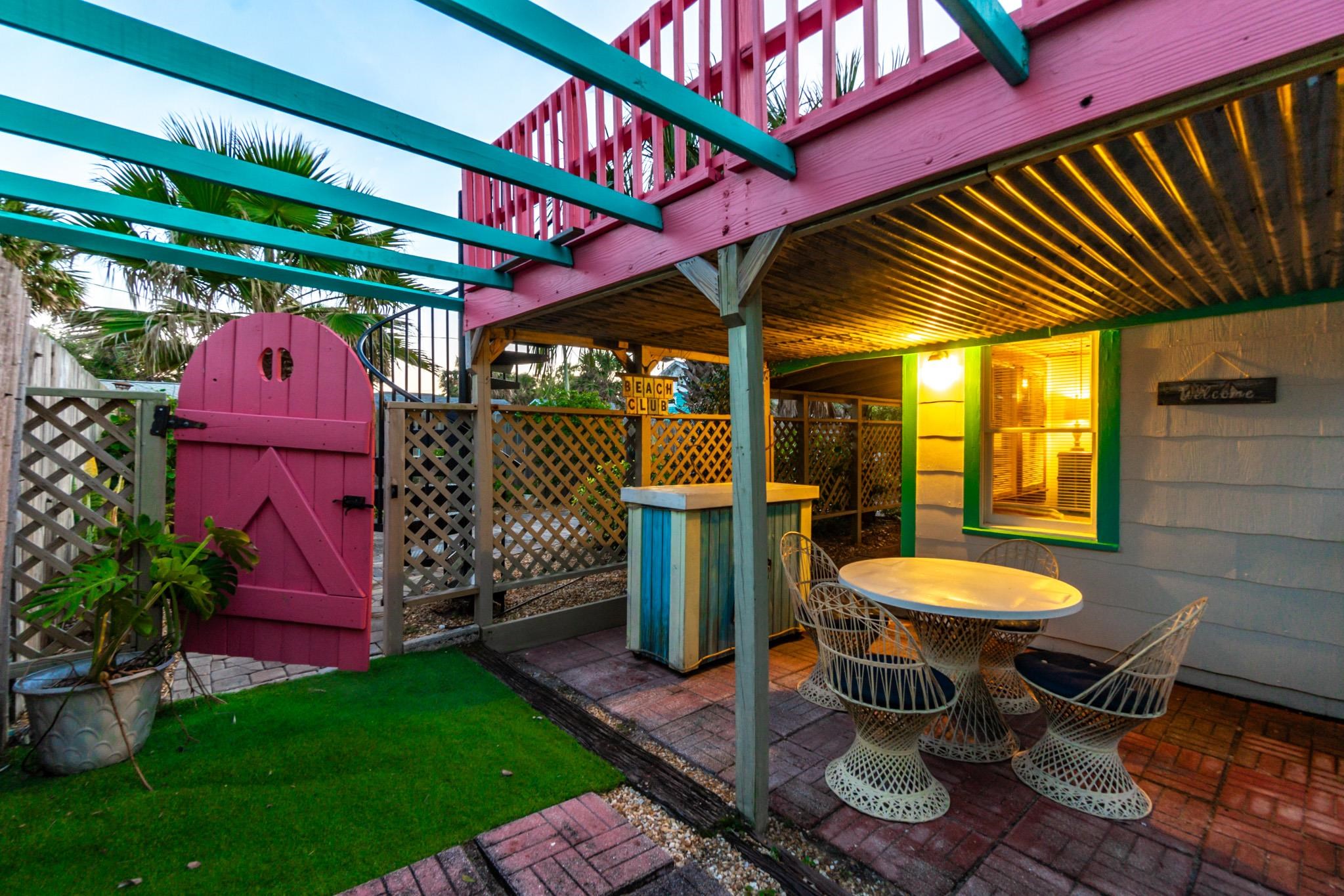 51 Beachcomber Way St. Augustine, FL 32084 - Photo 42 of 46 a view of a backyard with table and chairs potted plants