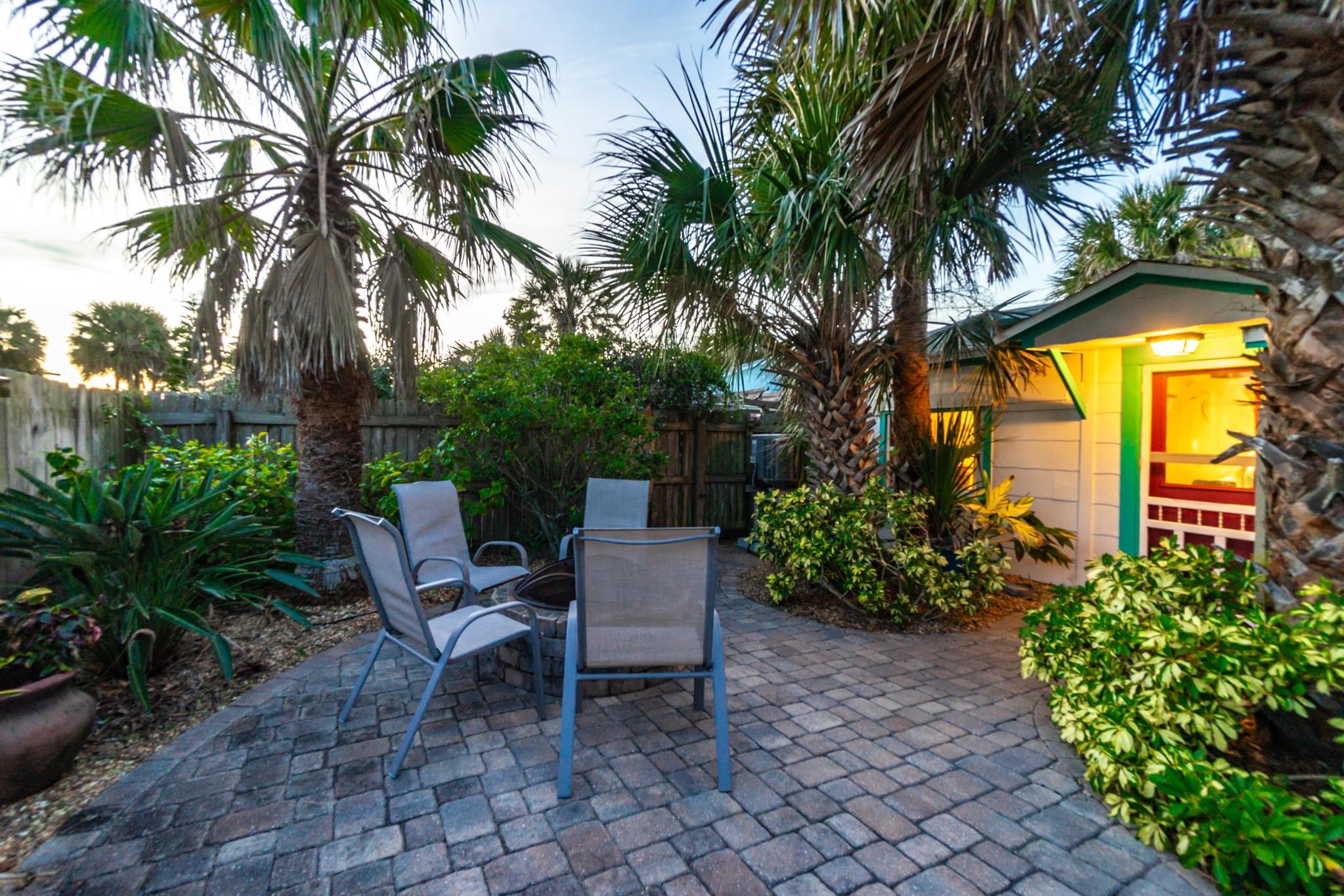 51 Beachcomber Way St. Augustine, FL 32084 - Photo 43 of 46 a backyard of a house with a garden and outdoor seating