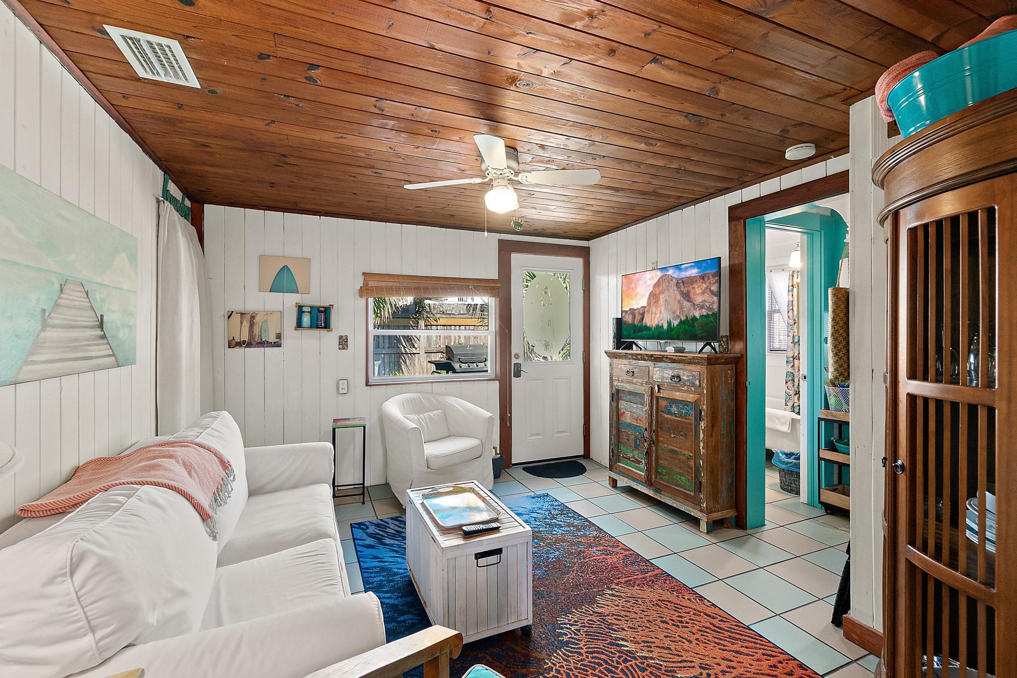 51 Beachcomber Way St. Augustine, FL 32084 - Photo 5 of 46 a living room with furniture a flat screen tv and a table