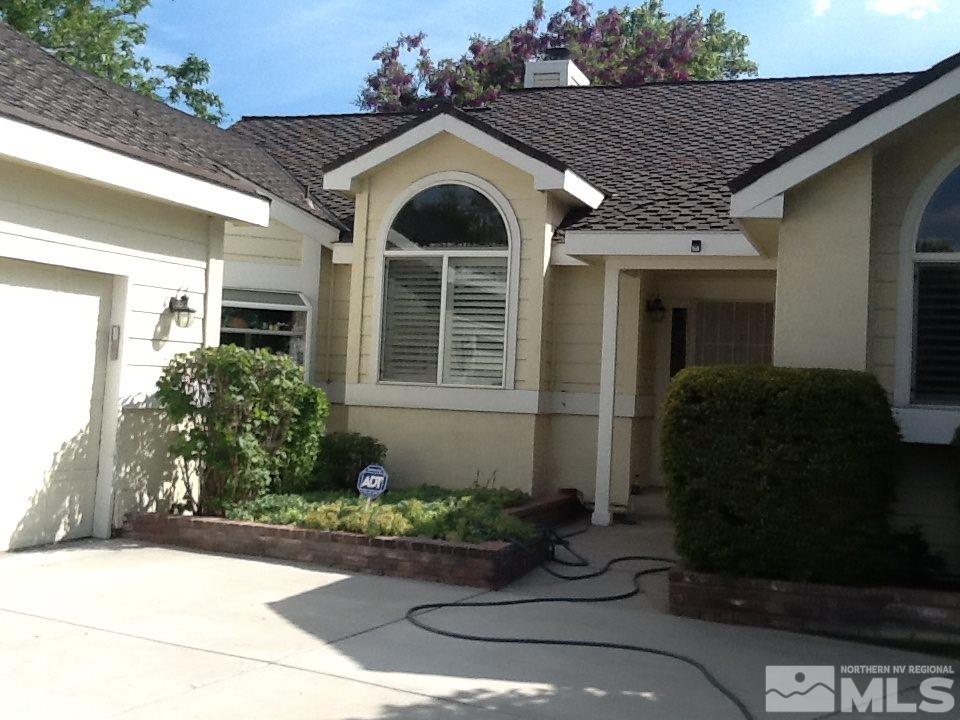 1020 High Chaparral Drive Reno, NV 89521 - Photo 1 of 1 a front view of a house with garden