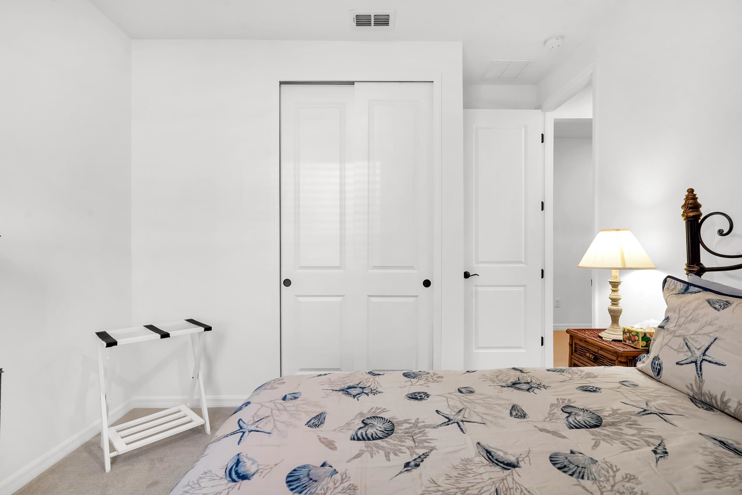 127 Shell Crk Court St. Augustine, FL 32086 - Photo 27 of 37 a bedroom with a bed and a lamp
