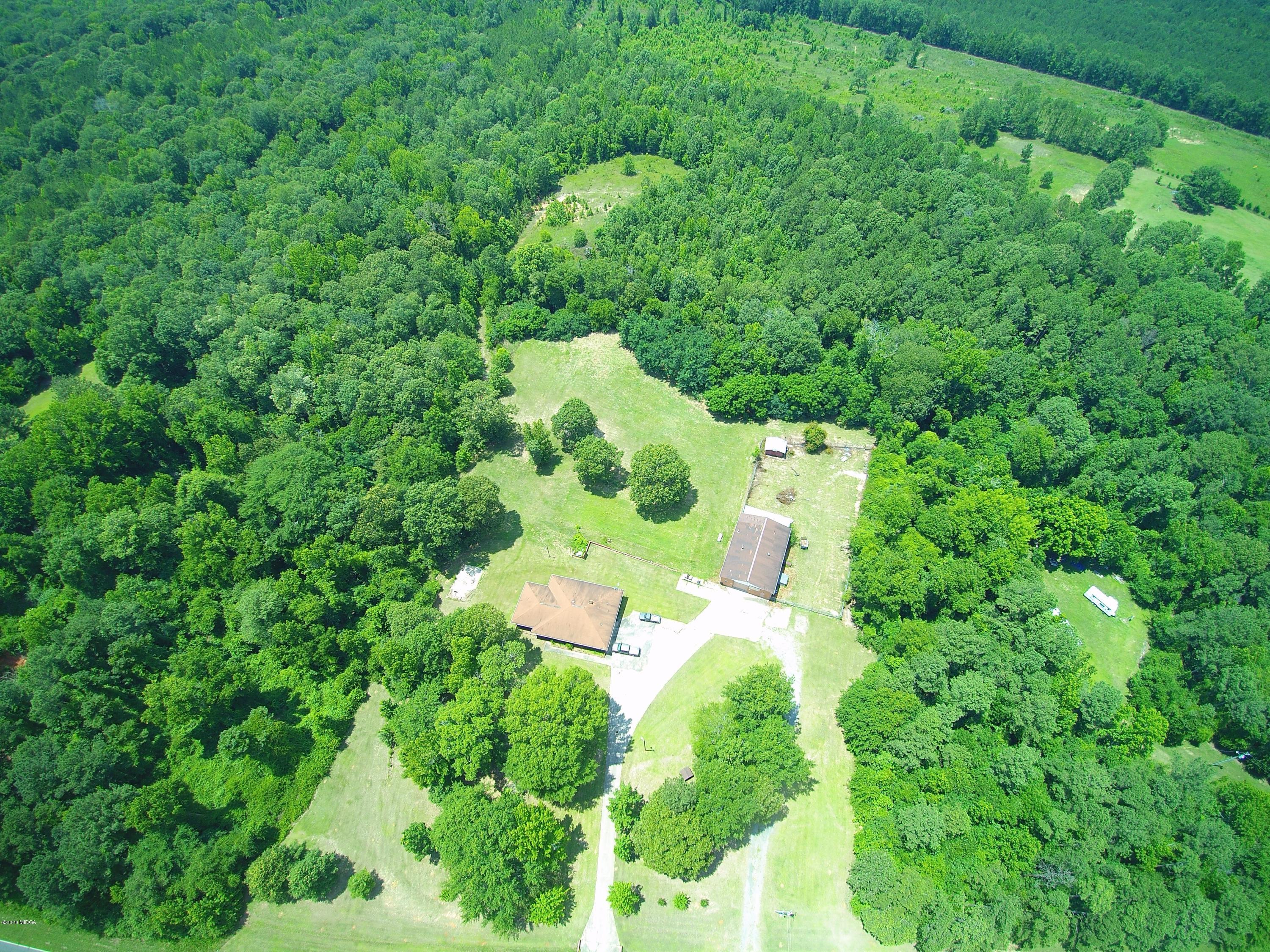 962 Cummings Road Fort Valley, GA 31030 - Photo 22 of 32 an aerial view of residential house with outdoor space and trees all around