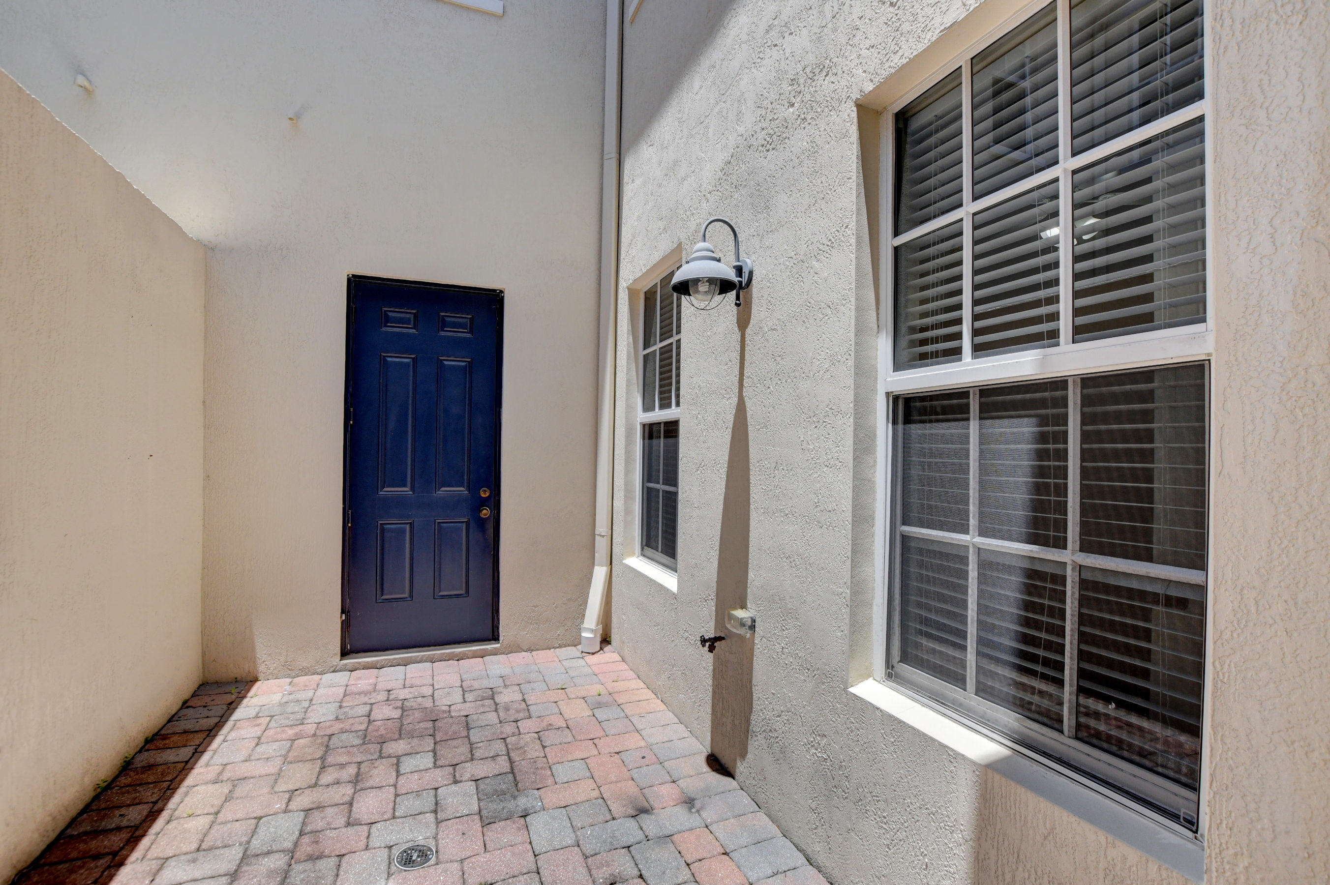 8308 Northwest 8th Way Boca Raton, FL 33487 - Photo 17 of 52 Outside patio leads to garage