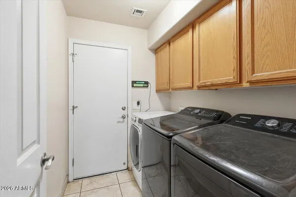 a kitchen with a sink a stove and cabinets