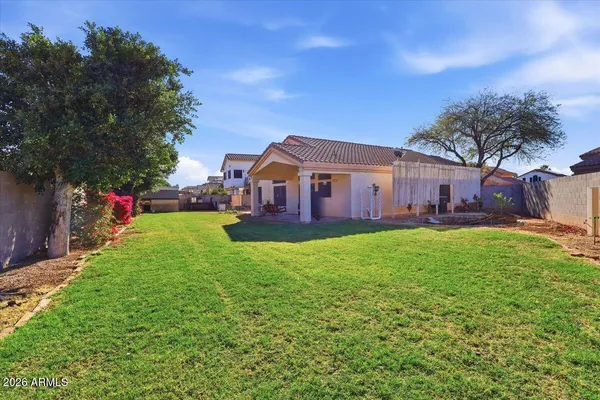 a view of a house with a back yard