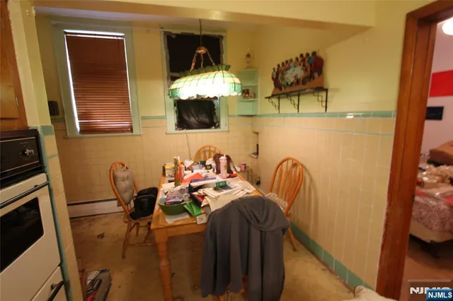 a dining room with furniture and chandelier