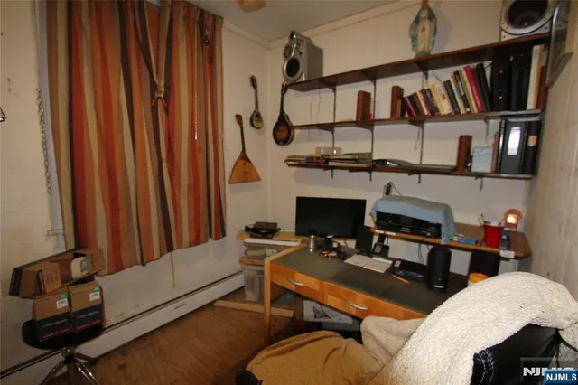 a view of a livingroom with furniture and a window